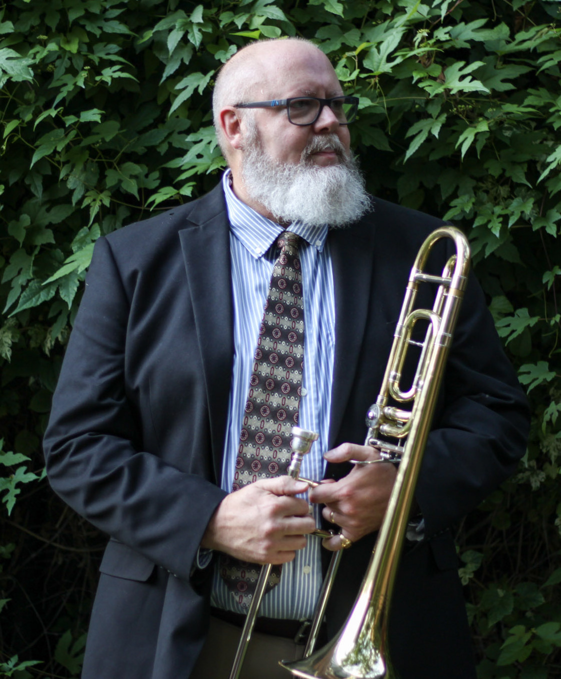 Timothy Anderson holding a trombone